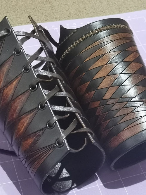 1 OF 1 LEATHER WRIST BRACERS